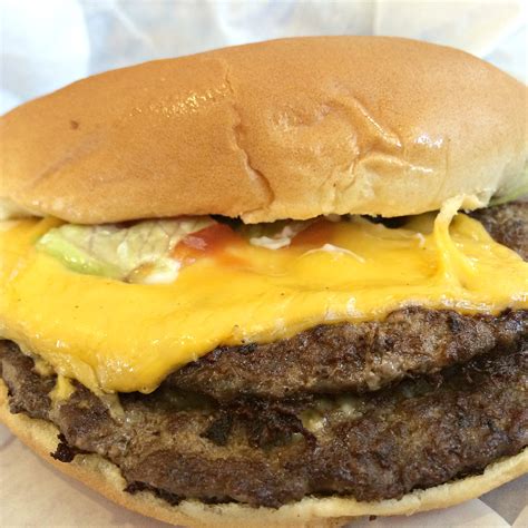 How does 1/4 Pound Double Cheeseburger fit into your Daily Goals - calories, carbs, nutrition