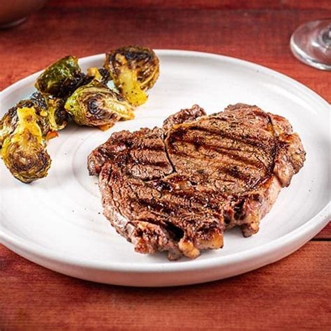 How does 10oz Ribeye Steak fit into your Daily Goals - calories, carbs, nutrition