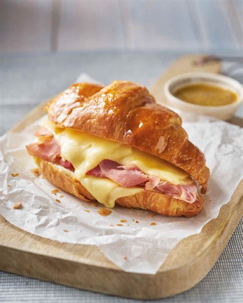 How does 155 Sunrise Croissant with Ham & Cheese fit into your Daily Goals - calories, carbs, nutrition