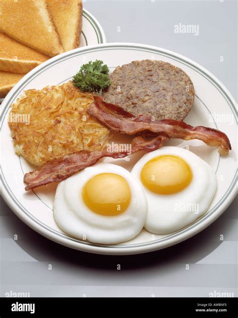 How does 4 Item Hot Breakfast (2 eggs, 2 slices bacon, 1 sausage patty, hashbrowns, coffee) fit into your Daily Goals - calories, carbs, nutrition