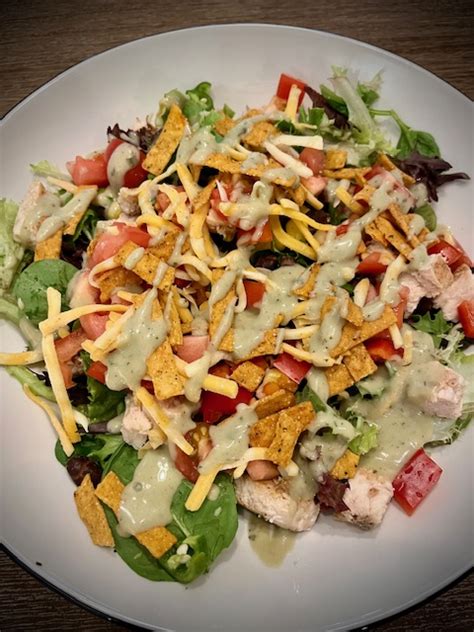 How does 99 Fiesta Grilled Chicken Salad fit into your Daily Goals - calories, carbs, nutrition