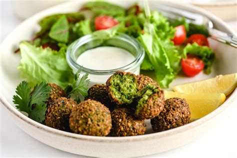 How does Aromatic Falafel served in a Toasted Soft Bun fit into your Daily Goals - calories, carbs, nutrition
