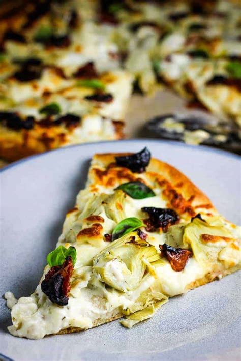 How does Artichoke and Sun-Dried Tomato Pizza fit into your Daily Goals - calories, carbs, nutrition