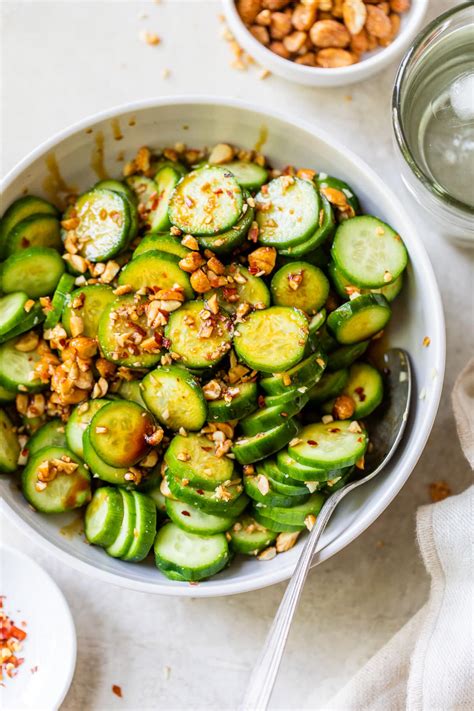 How does Asian Cucumber Salad with Wheat Roll and Fruit Salad fit into your Daily Goals - calories, carbs, nutrition