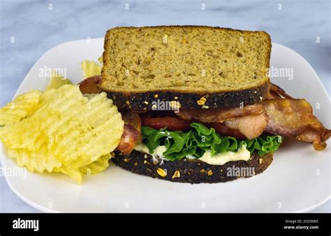 How does BLT Sandwich on Wheat Bread fit into your Daily Goals - calories, carbs, nutrition