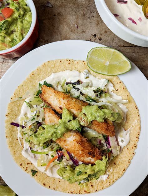 How does Baja Style Fish Tacos with Tilapia Southwestern Slaw fit into your Daily Goals - calories, carbs, nutrition