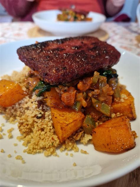 How does Baked Brisket of Beef with Roasted Vegetable Cous Cous and Butternut Squash with Baby Spinach fit into your Daily Goals - calories, carbs, nutrition