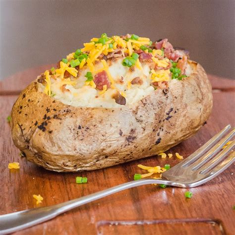 How does Baked Potato with Cheddar and Bacon Bits fit into your Daily Goals - calories, carbs, nutrition