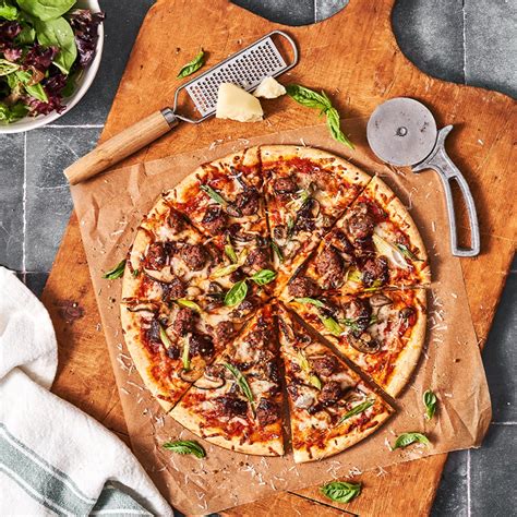 How does Beef and Mushroom Pizza fit into your Daily Goals - calories, carbs, nutrition