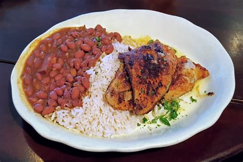 How does Blackened Catfish with Red Beans and Rice Andouille Sausage with Spinach with Roasted Red Peppers fit into your Daily Goals - calories, carbs, nutrition