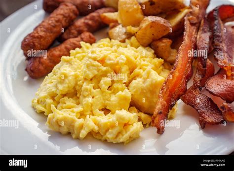 How does Breakfast Pancake Platter with Sausage, Scrambled Eggs Homefries fit into your Daily Goals - calories, carbs, nutrition