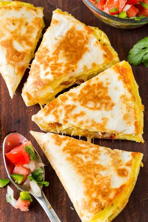 How does Breakfast Quesadilla (1) fit into your Daily Goals - calories, carbs, nutrition