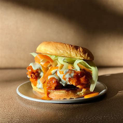 How does Buffalo Blue Chicken Sandwich (34921.324) fit into your Daily Goals - calories, carbs, nutrition