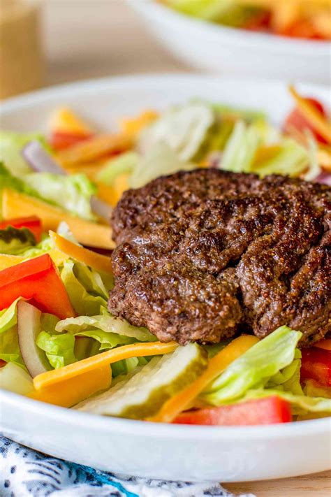 How does Build a Burger with Salad fit into your Daily Goals - calories, carbs, nutrition