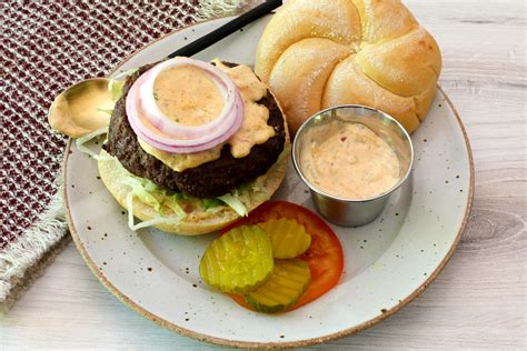 How does Cajun Burger on White Bun fit into your Daily Goals - calories, carbs, nutrition