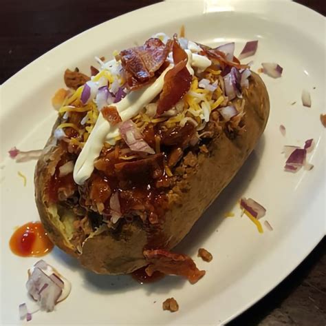 How does Carolina Pork Stuffed Potato fit into your Daily Goals - calories, carbs, nutrition