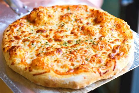 How does Cheese Pizza (32147.22) fit into your Daily Goals - calories, carbs, nutrition