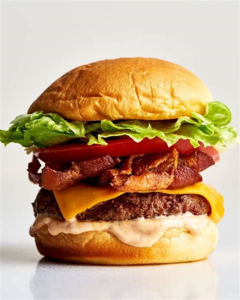 How does Cheese and bacon burger meal fit into your Daily Goals - calories, carbs, nutrition