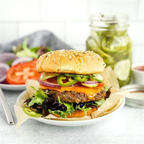 How does Cheeseburger 4 oz Lettuce Tomato Pickle Chips Unseeded Bun fit into your Daily Goals - calories, carbs, nutrition