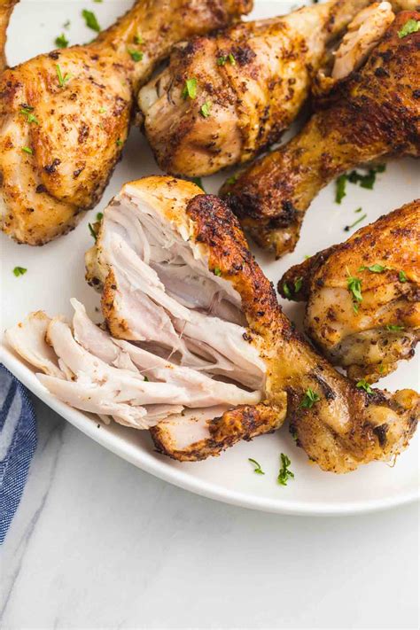 How does Chicken, skin (drumsticks and thighs), enhanced, cooked, braised fit into your Daily Goals - calories, carbs, nutrition