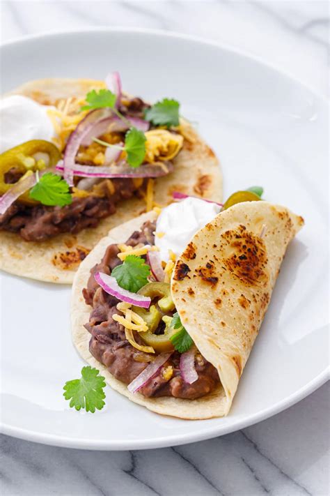 How does Chicken Bacon Black Bean Taco fit into your Daily Goals - calories, carbs, nutrition