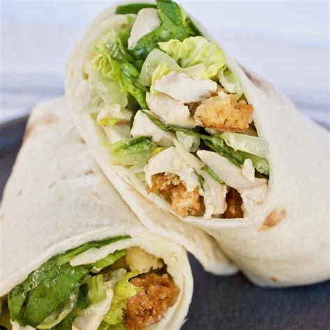 How does Chicken Caesar Wrap with Triple Bean Salad fit into your Daily Goals - calories, carbs, nutrition