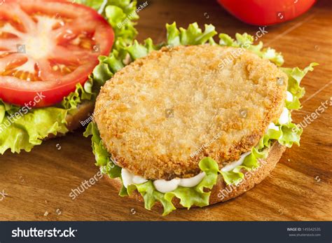 How does Chicken Patty Sandwich, Lettuce, Tomato, Dressing fit into your Daily Goals - calories, carbs, nutrition