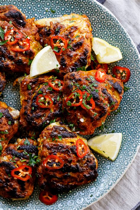 How does Chicken Thigh Tikka 2 oz fit into your Daily Goals - calories, carbs, nutrition