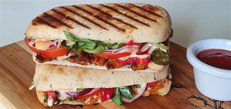 How does Chicken Tikka Panini Garnished with Mixed Leaves fit into your Daily Goals - calories, carbs, nutrition