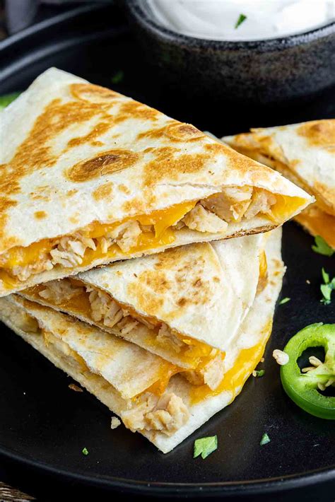 How does Chicken and Cheese Quesadilla - Baked fit into your Daily Goals - calories, carbs, nutrition