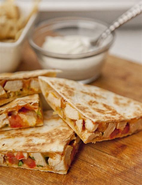 How does Chicken and Cheese Quesadilla fit into your Daily Goals - calories, carbs, nutrition