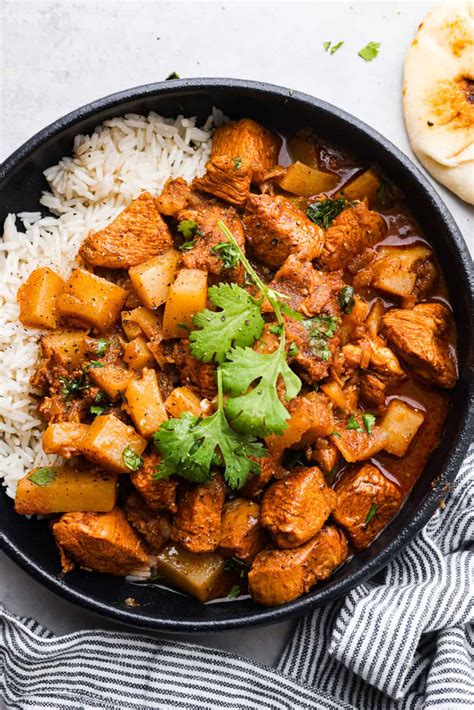 How does Chicken and Lentils Vindaloo with Rice and Naan fit into your Daily Goals - calories, carbs, nutrition