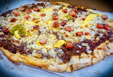 How does Coney Island Pizza Wheat Crust fit into your Daily Goals - calories, carbs, nutrition