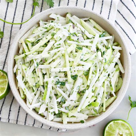 How does Curried Chicken and Green Apple Salad Wrap and Jicama Slaw fit into your Daily Goals - calories, carbs, nutrition