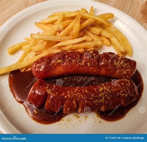 How does Currywurst with Pommes Frites & Sauerkraut fit into your Daily Goals - calories, carbs, nutrition