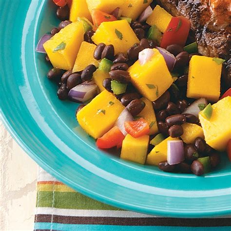 How does Dominican Black Bean Mango Salad Plate fit into your Daily Goals - calories, carbs, nutrition