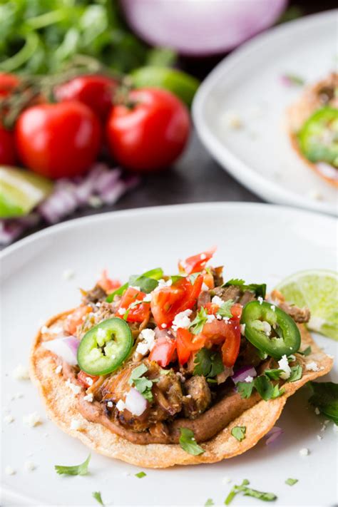 How does Dos Tostadas Pork Carnitas fit into your Daily Goals - calories, carbs, nutrition