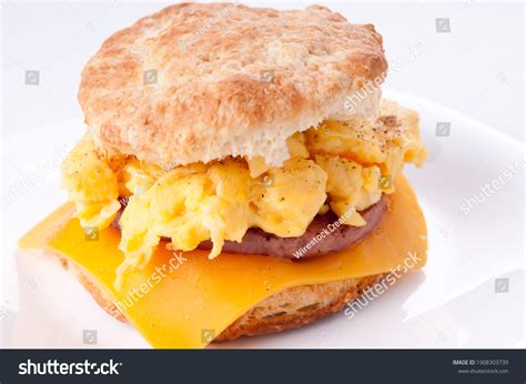 How does Egg Sausage Cheese Sandwich (25374.0) fit into your Daily Goals - calories, carbs, nutrition