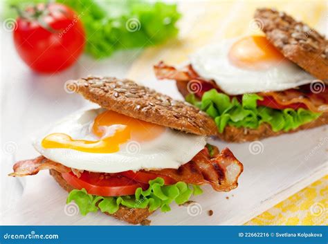 How does Egg and Bacon Sandwich - Wholemeal Bread fit into your Daily Goals - calories, carbs, nutrition