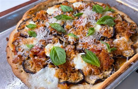 How does Eggplant, Parmesan, Arugula Flatbread fit into your Daily Goals - calories, carbs, nutrition