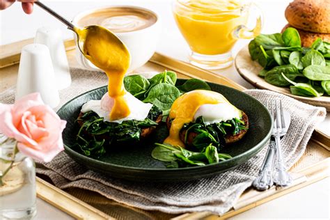 How does Eggs Benedict with Ham and Wilted Spinach fit into your Daily Goals - calories, carbs, nutrition