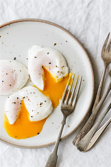 How does Eggs Poached 1 EA fit into your Daily Goals - calories, carbs, nutrition