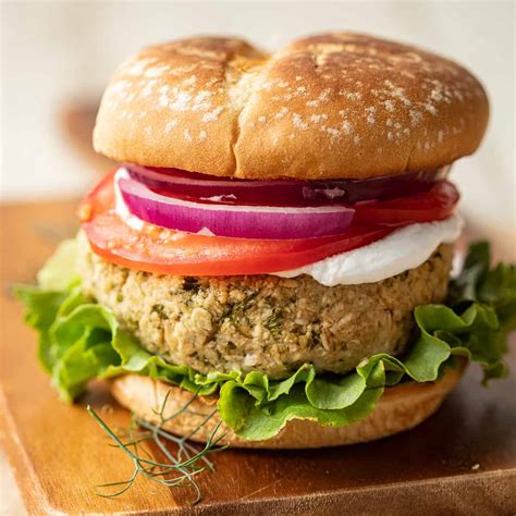 How does Falafel Burger w/cheese on wheat roll fit into your Daily Goals - calories, carbs, nutrition