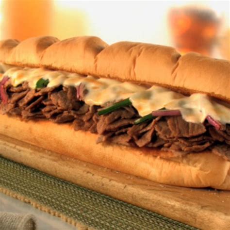 How does Footlong Steak & Cheese Sub fit into your Daily Goals - calories, carbs, nutrition