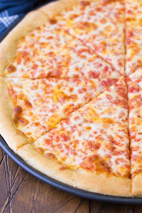 How does Four Cheese Wheat Pizza fit into your Daily Goals - calories, carbs, nutrition