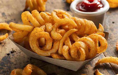 How does French Fries Curly 7 oz fit into your Daily Goals - calories, carbs, nutrition