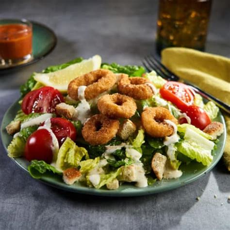 How does Fried Calamari Caesar Salad fit into your Daily Goals - calories, carbs, nutrition