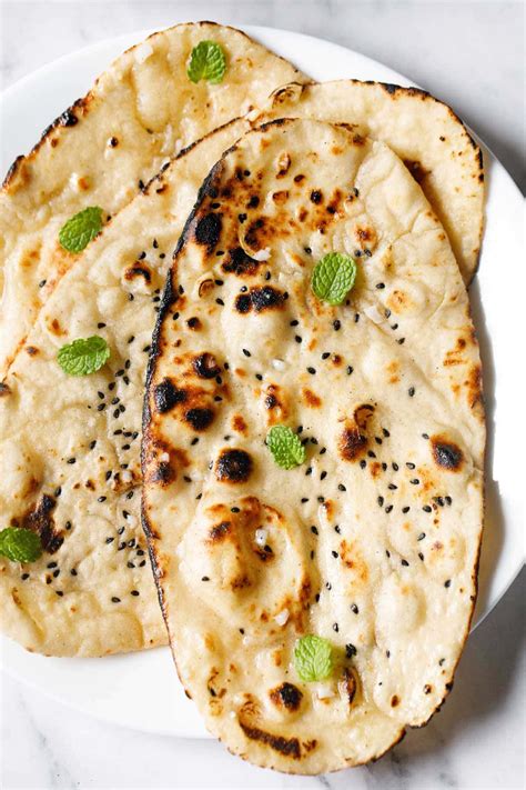 How does Garlic Naan (62266.4) fit into your Daily Goals - calories, carbs, nutrition