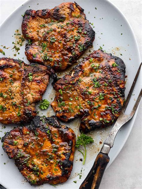 How does Grilled Bourbon Marinated Pork Chop fit into your Daily Goals - calories, carbs, nutrition