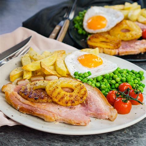 How does Grilled Gammon Steak with a Fried Free Range Egg fit into your Daily Goals - calories, carbs, nutrition